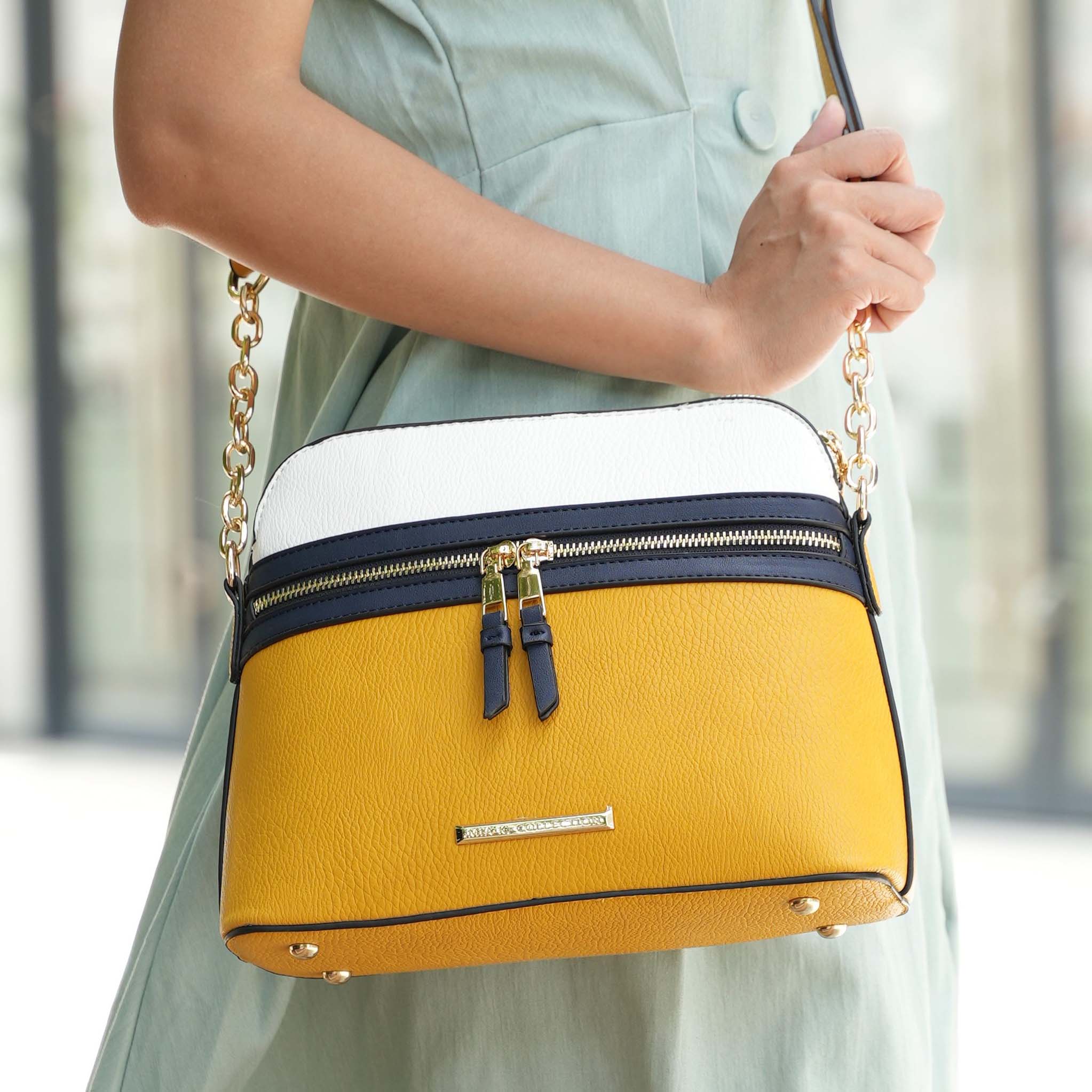 Structured dome crossbody bag in pebble-texture vegan leather with gold chain strap and brushed gold hardware