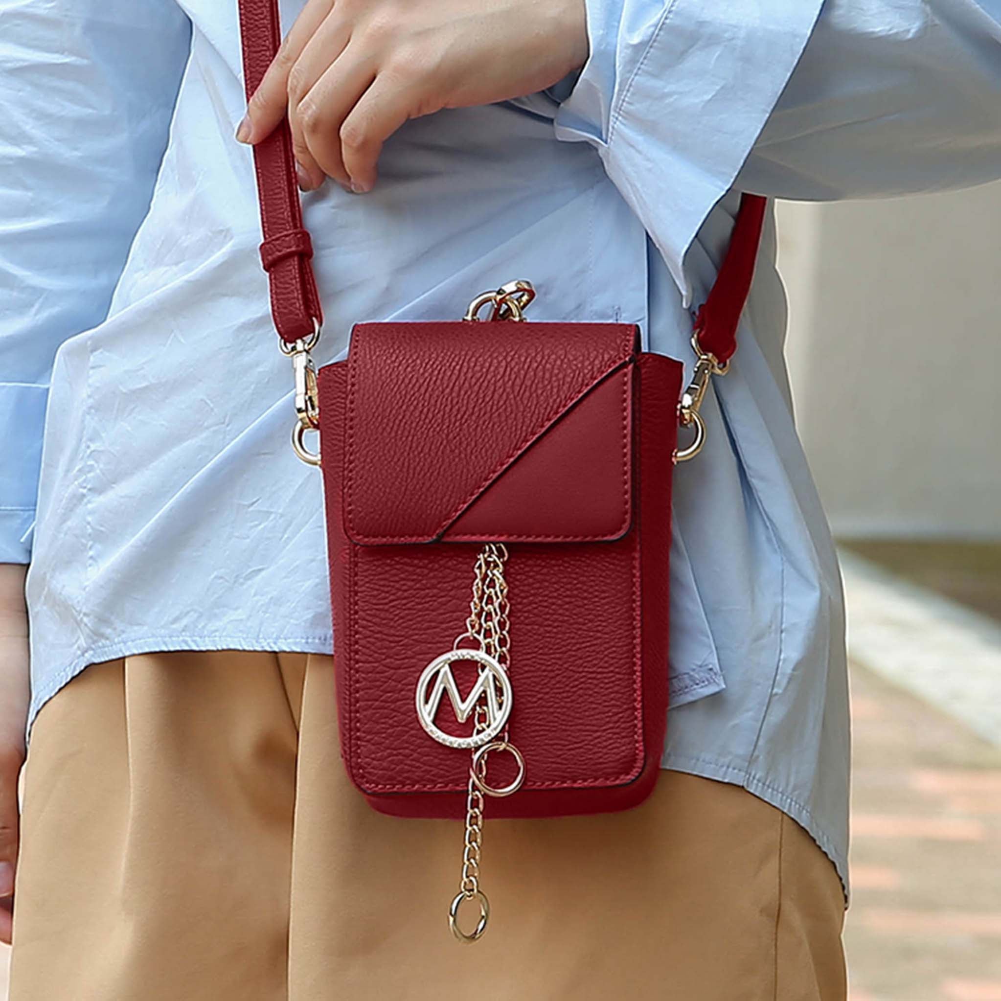 Petite-fit vegan leather crossbody wristlet with gold medallion charm and magnetic snap closure