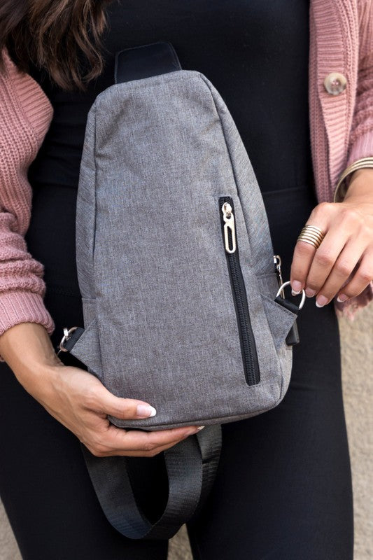 Cross Zip Sling Bag Canvas Exterior Nylon Interior Adjustable Strap Multiple Pockets Earphone Slot Silver Hardware