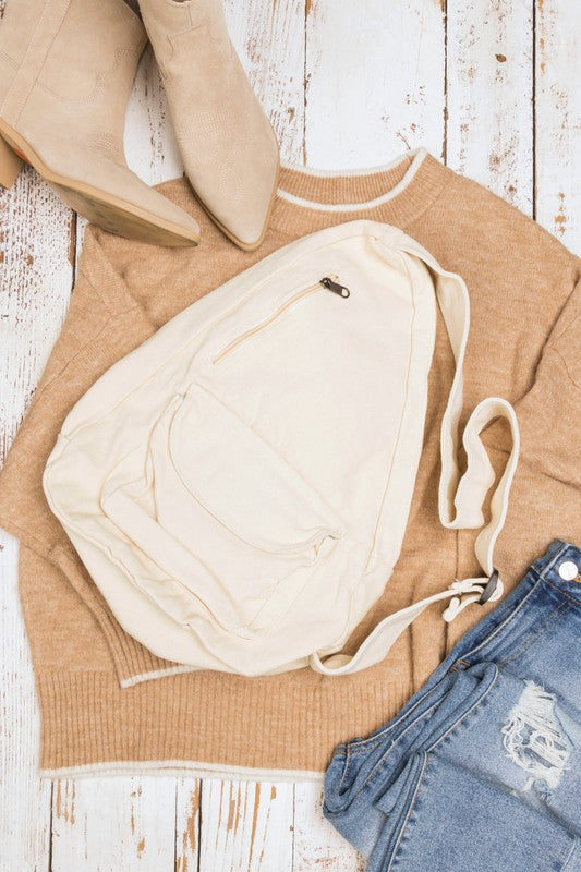 Oversized Canvas Sling Bag with Adjustable Strap Side Zip Closure Front Velcro Pocket Interior Zip Pocket
