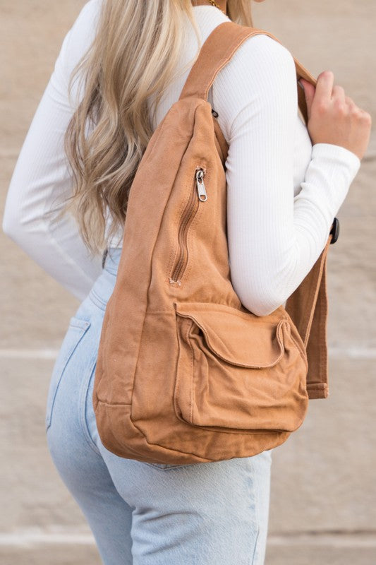 Oversized Canvas Sling Bag with Adjustable Strap Side Zip Closure Front Velcro Pocket Interior Zip Pocket
