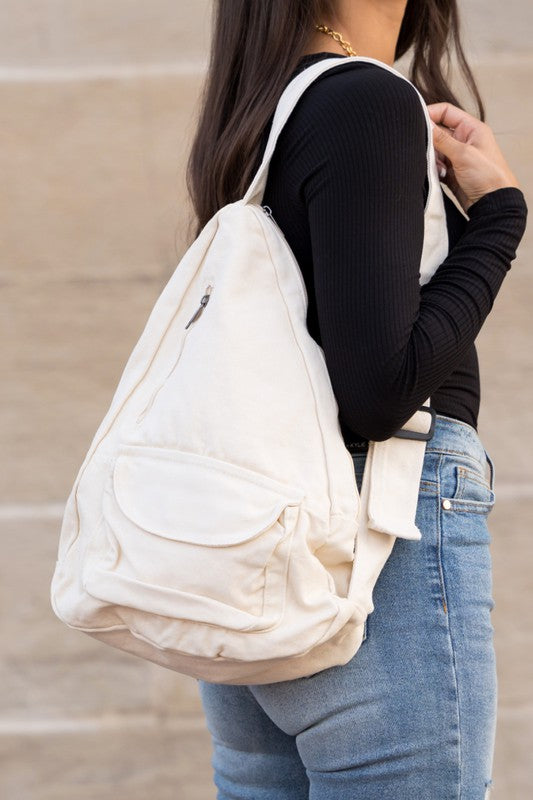 Oversized Canvas Sling Bag with Adjustable Strap Side Zip Closure Front Velcro Pocket Interior Zip Pocket