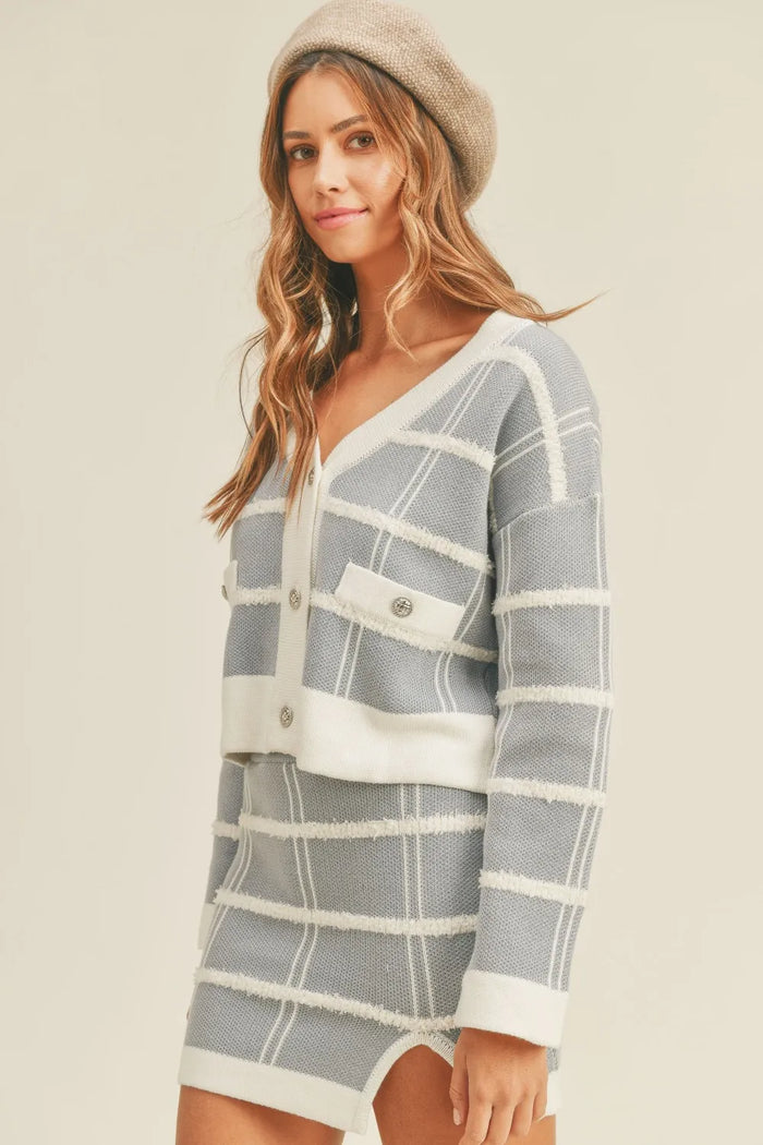 Petite woman wearing a well-fitted cardigan