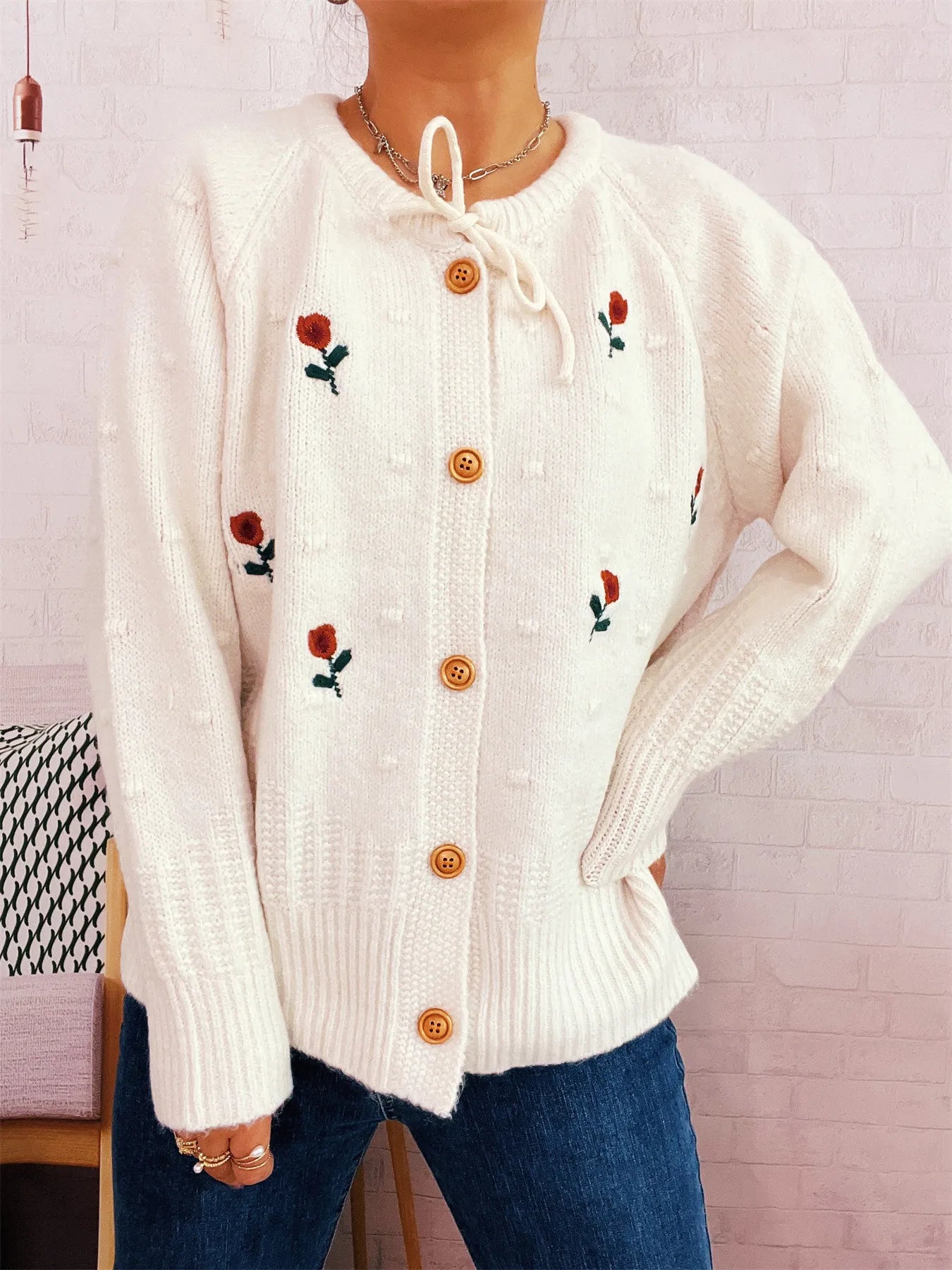 Elegant buttoned cardigan with tied design in yellow