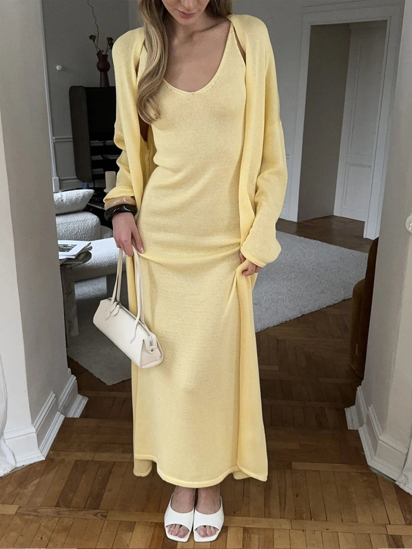 Chic two-piece cardigan set in pastel yellow with flattering slit design