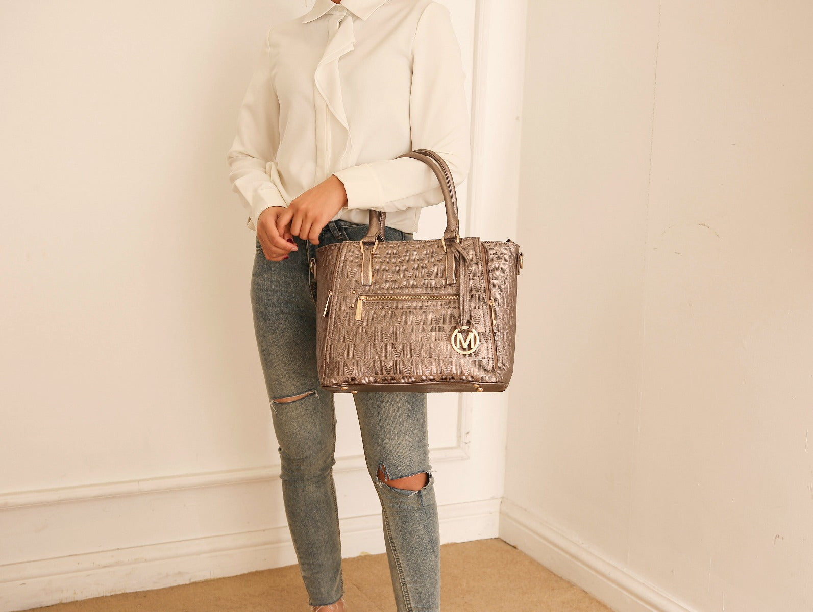 Structured navy embossed vegan leather satchel with gold hardware and rolled top handles